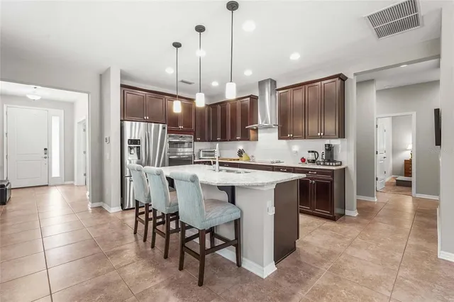 a kitchen with granite countertop stainless steel appliances and sink