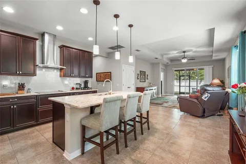a kitchen with granite countertop stainless steel appliances and wooden cabinets