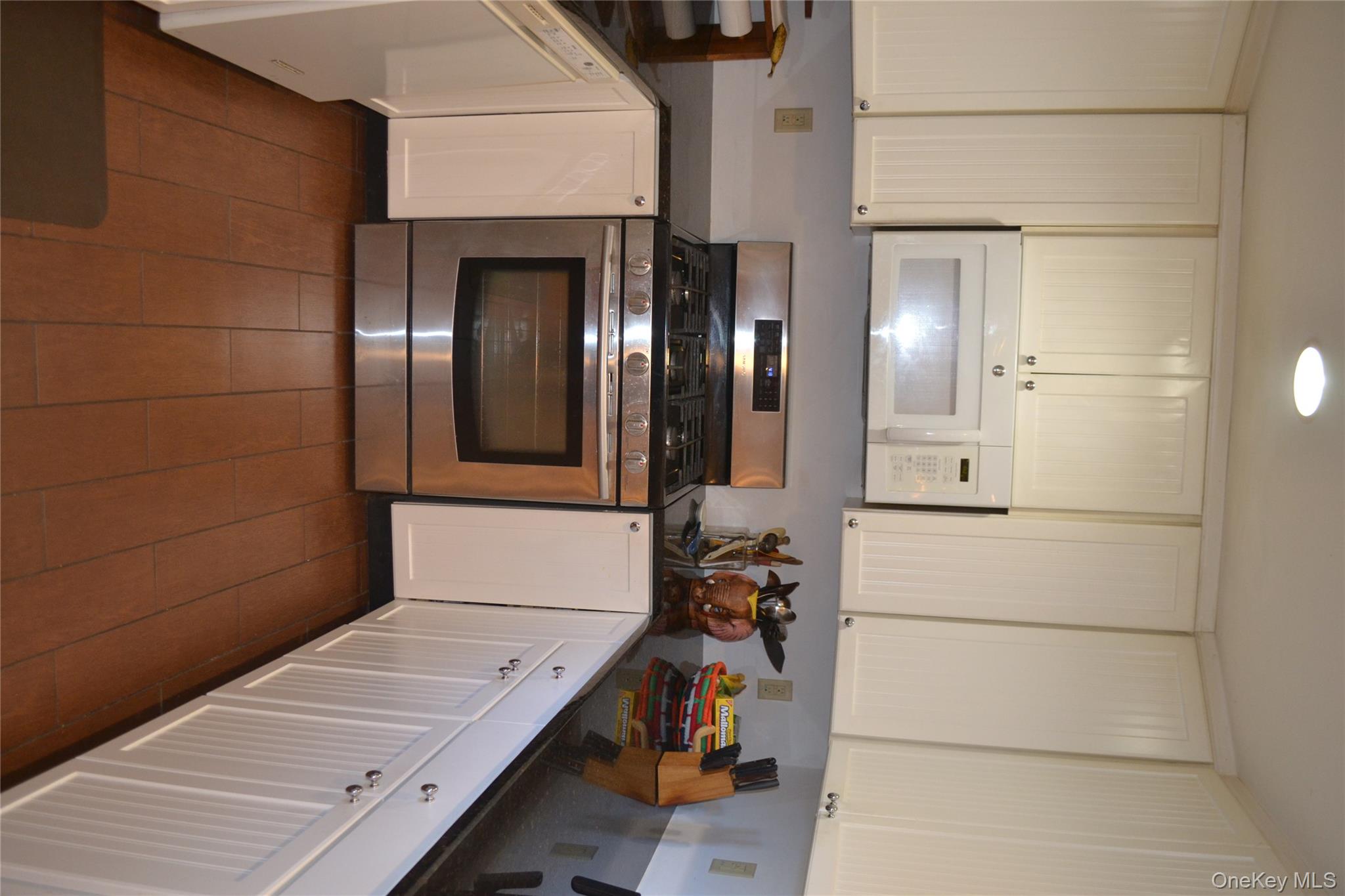 238 Trout Brook Road Roscoe, NY 12776 - Photo 11 of 32 a kitchen with granite countertop white cabinets and white appliances
