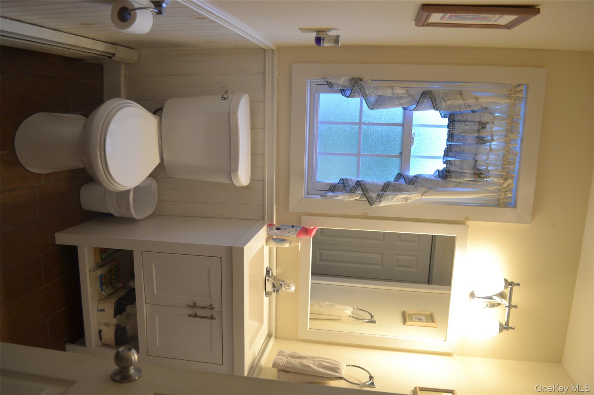 238 Trout Brook Road Roscoe, NY 12776 - Photo 13 of 32 a bathroom with a sink toilet and mirror