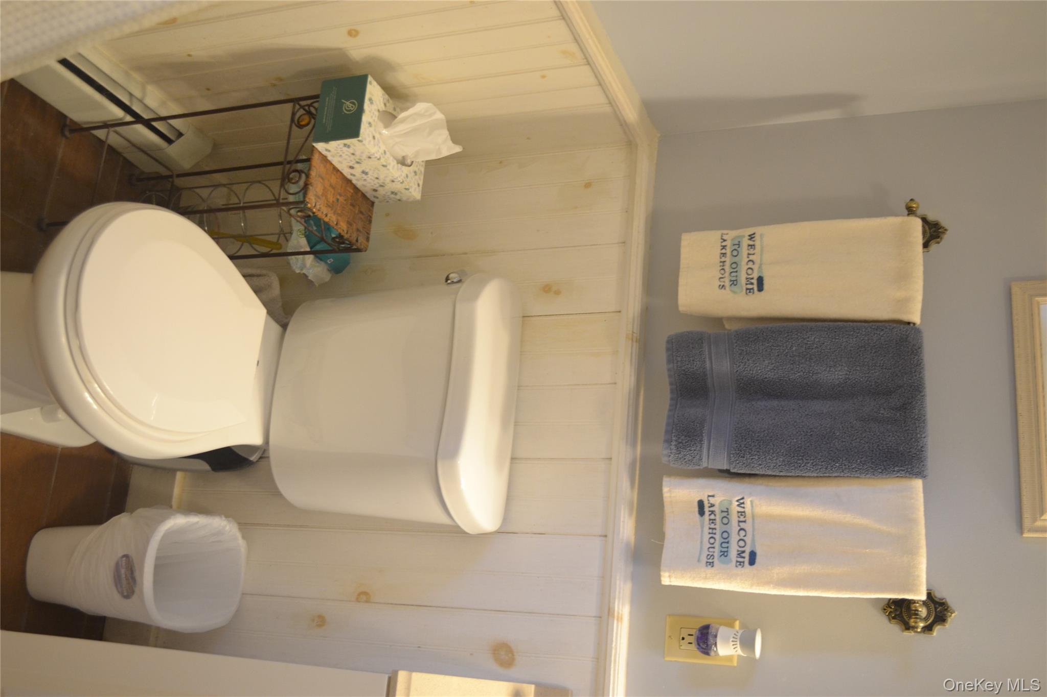 238 Trout Brook Road Roscoe, NY 12776 - Photo 18 of 32 a white toilet sitting next to a bathroom sink