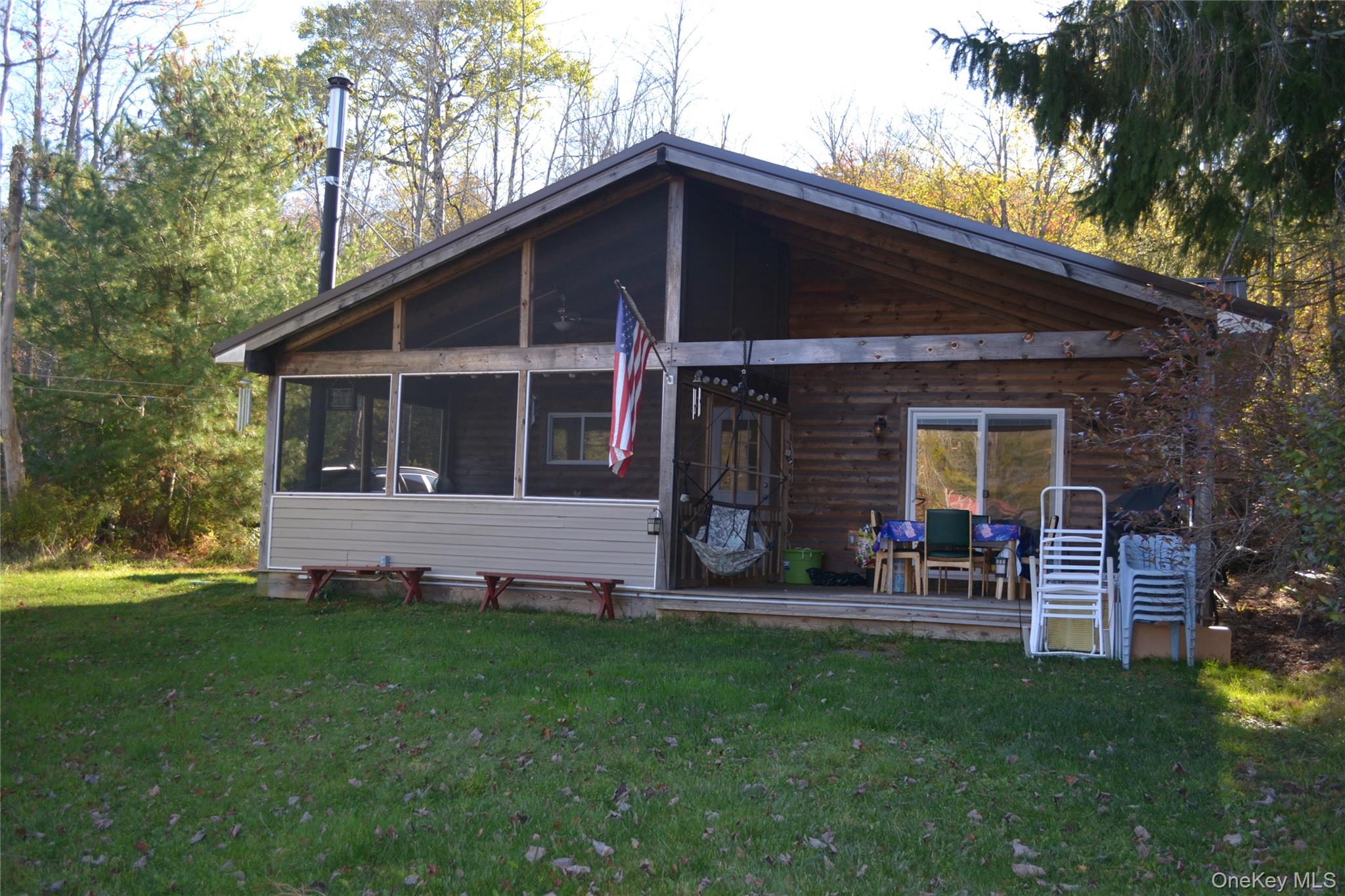 238 Trout Brook Road Roscoe, NY 12776 - Photo 2 of 32 a front view of house with yard and outdoor seating
