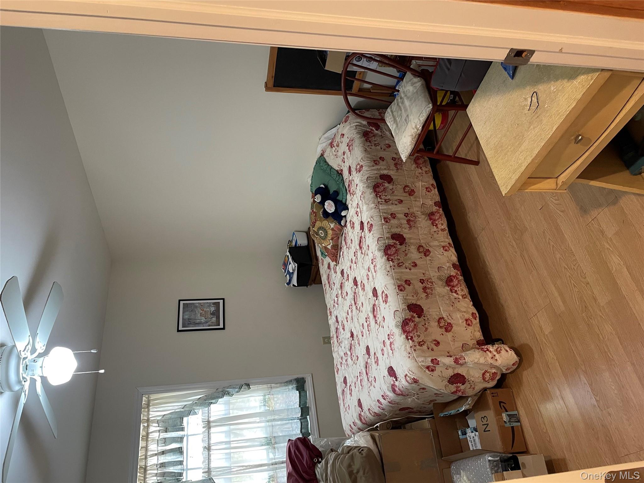 238 Trout Brook Road Roscoe, NY 12776 - Photo 22 of 32 a bedroom with a bed and a chandelier