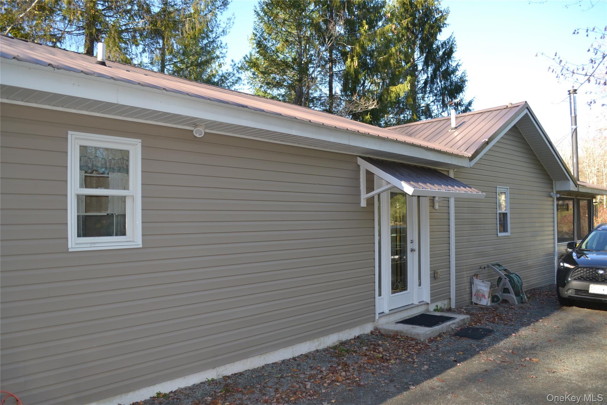 238 Trout Brook Road Roscoe, NY 12776 - Photo 3 of 32 a view of a house with a patio