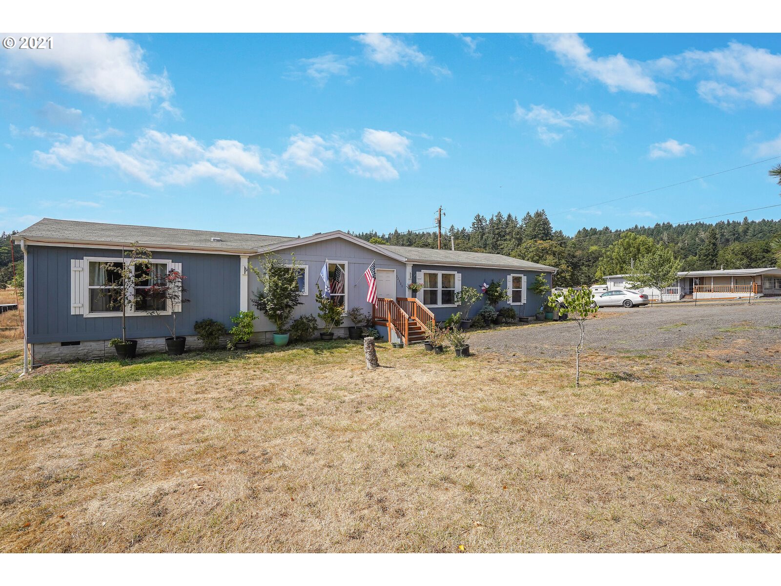 32300 Hidden Valley Road Lebanon, OR 97355 - Photo 1 of 29 a view of a house with a patio