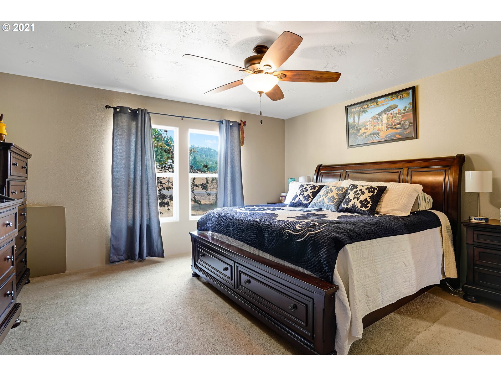 32300 Hidden Valley Road Lebanon, OR 97355 - Photo 13 of 29 a bedroom with a bed and a ceiling fan