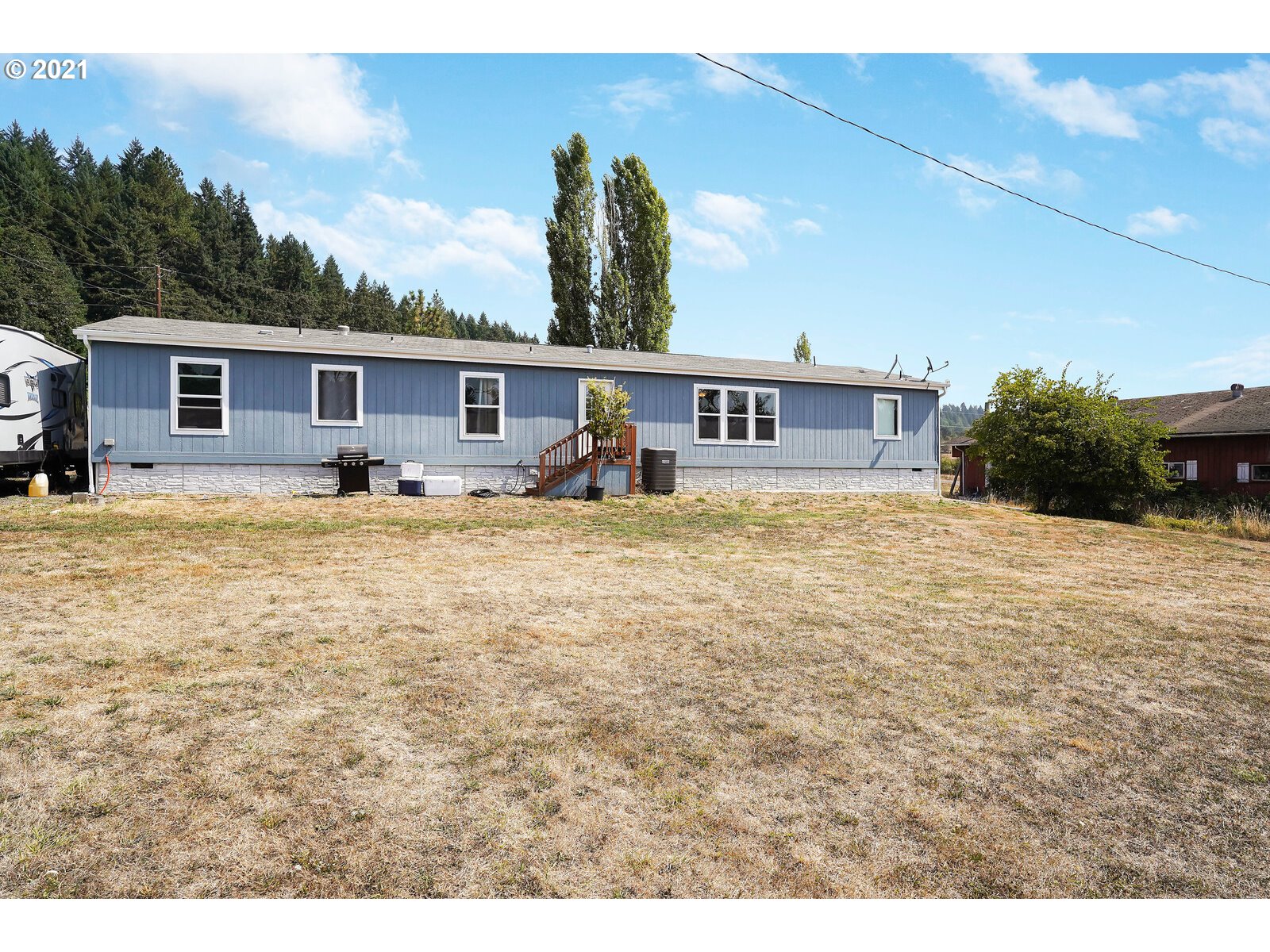 32300 Hidden Valley Road Lebanon, OR 97355 - Photo 22 of 29 a view of a house with a yard