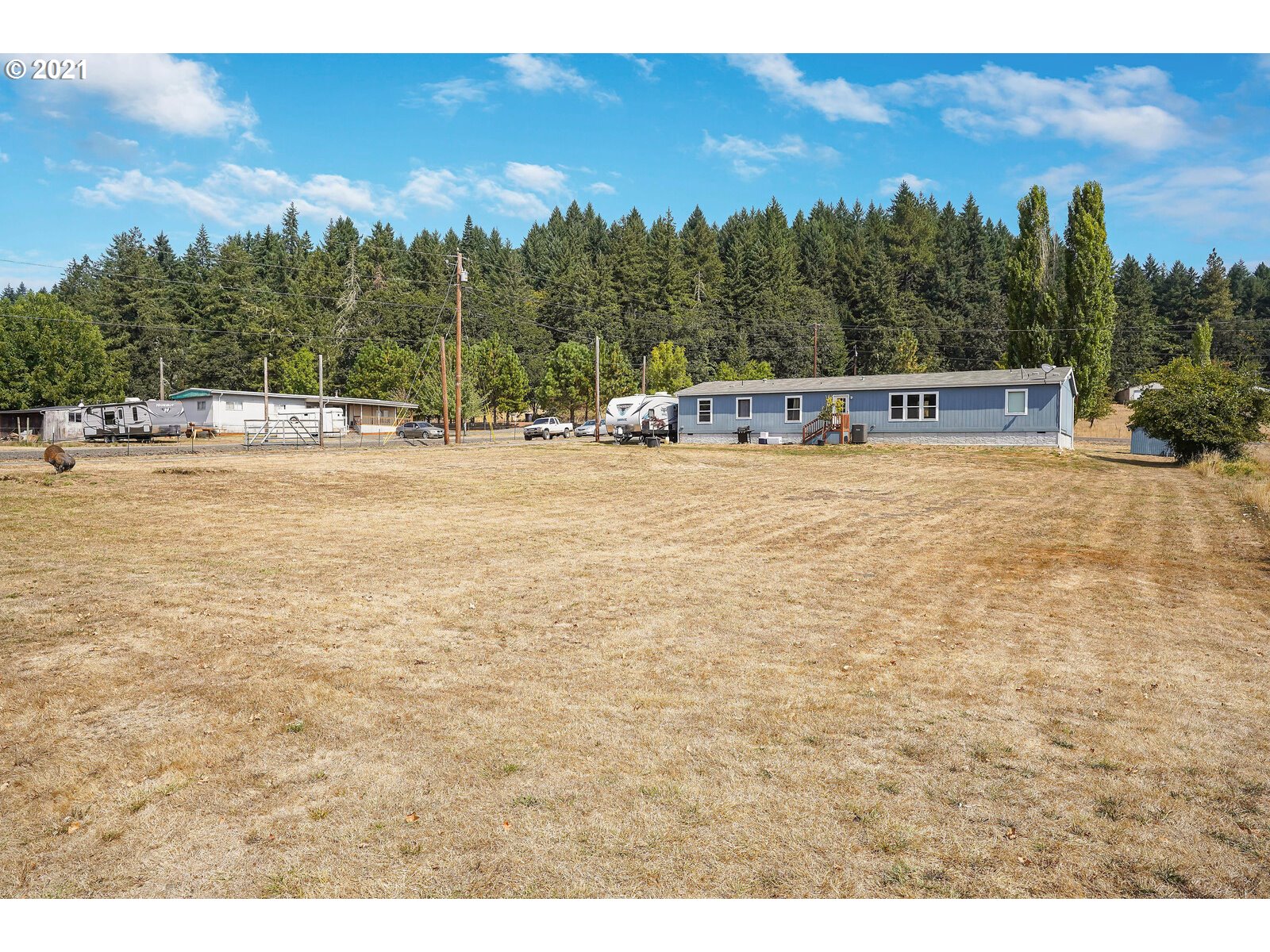 32300 Hidden Valley Road Lebanon, OR 97355 - Photo 24 of 29 a swimming pool with trees in the background