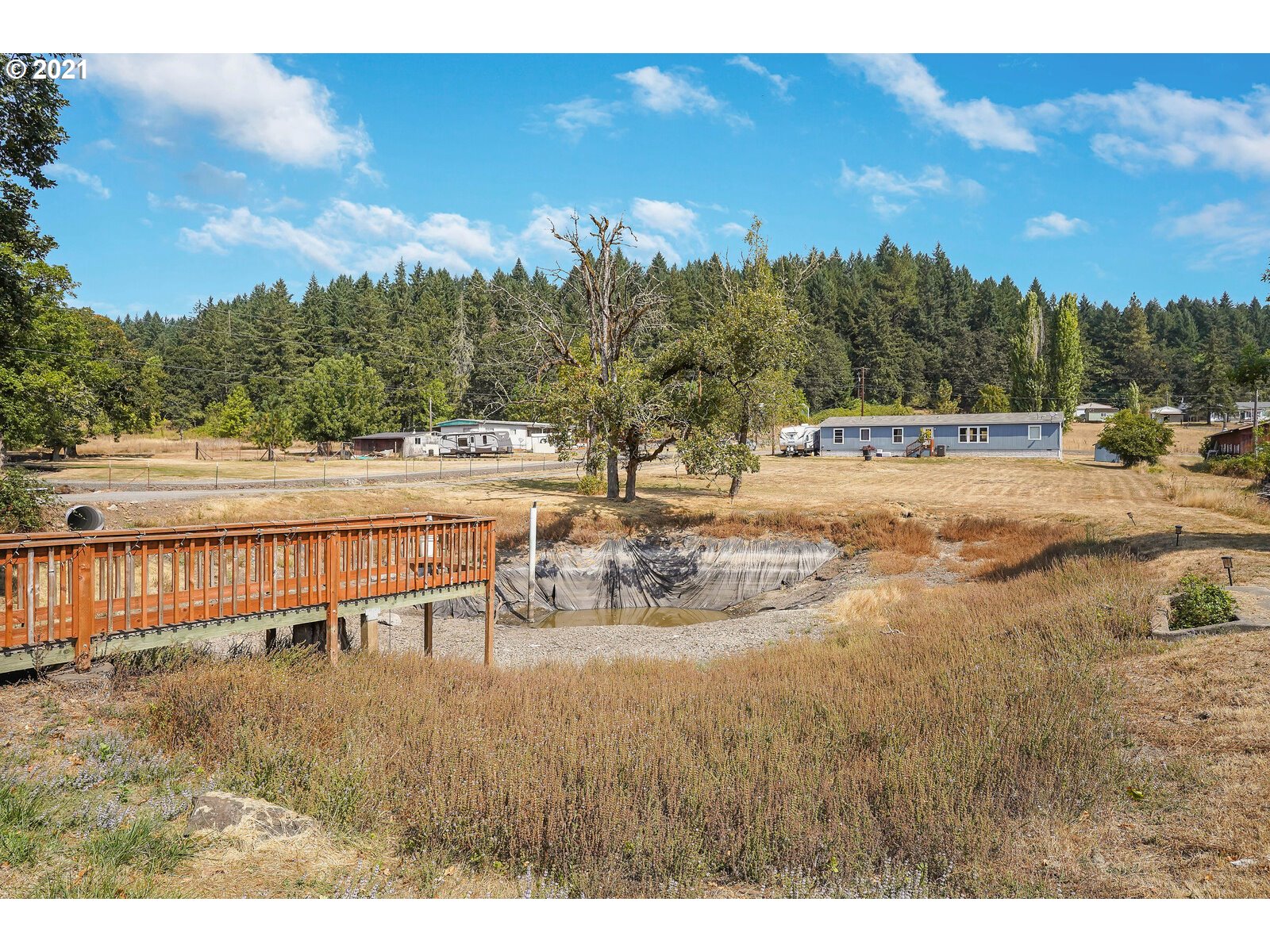32300 Hidden Valley Road Lebanon, OR 97355 - Photo 25 of 29 a view of a swimming pool with a yard and lake view