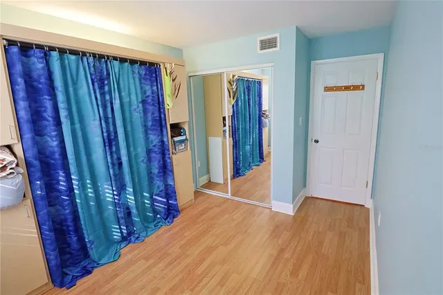 a view of a porch with wooden floor and stairs