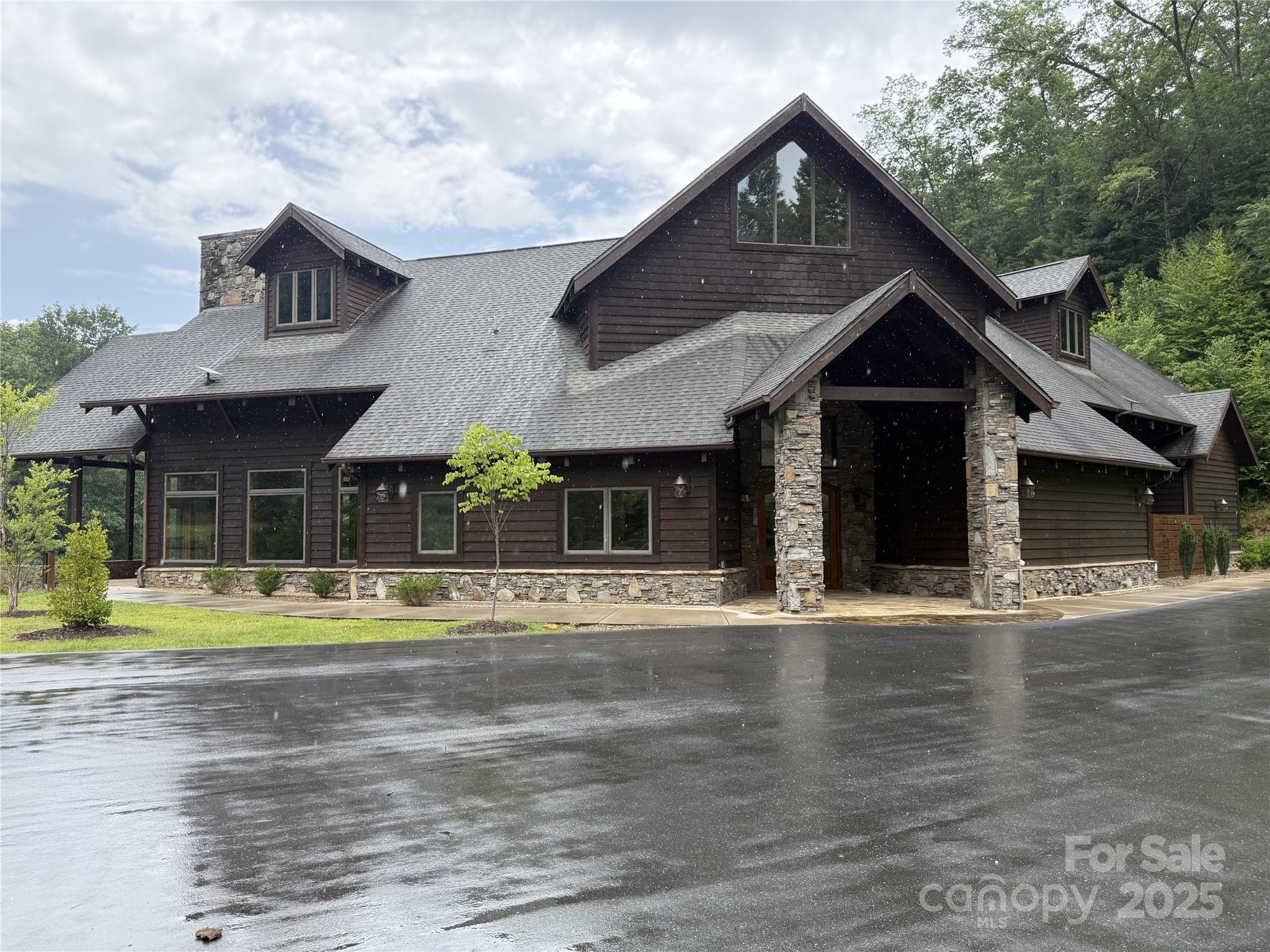 Lot 6 Garnet Road Sylva, NC 28779 - Photo 4 of 9 a front view of a house with a yard