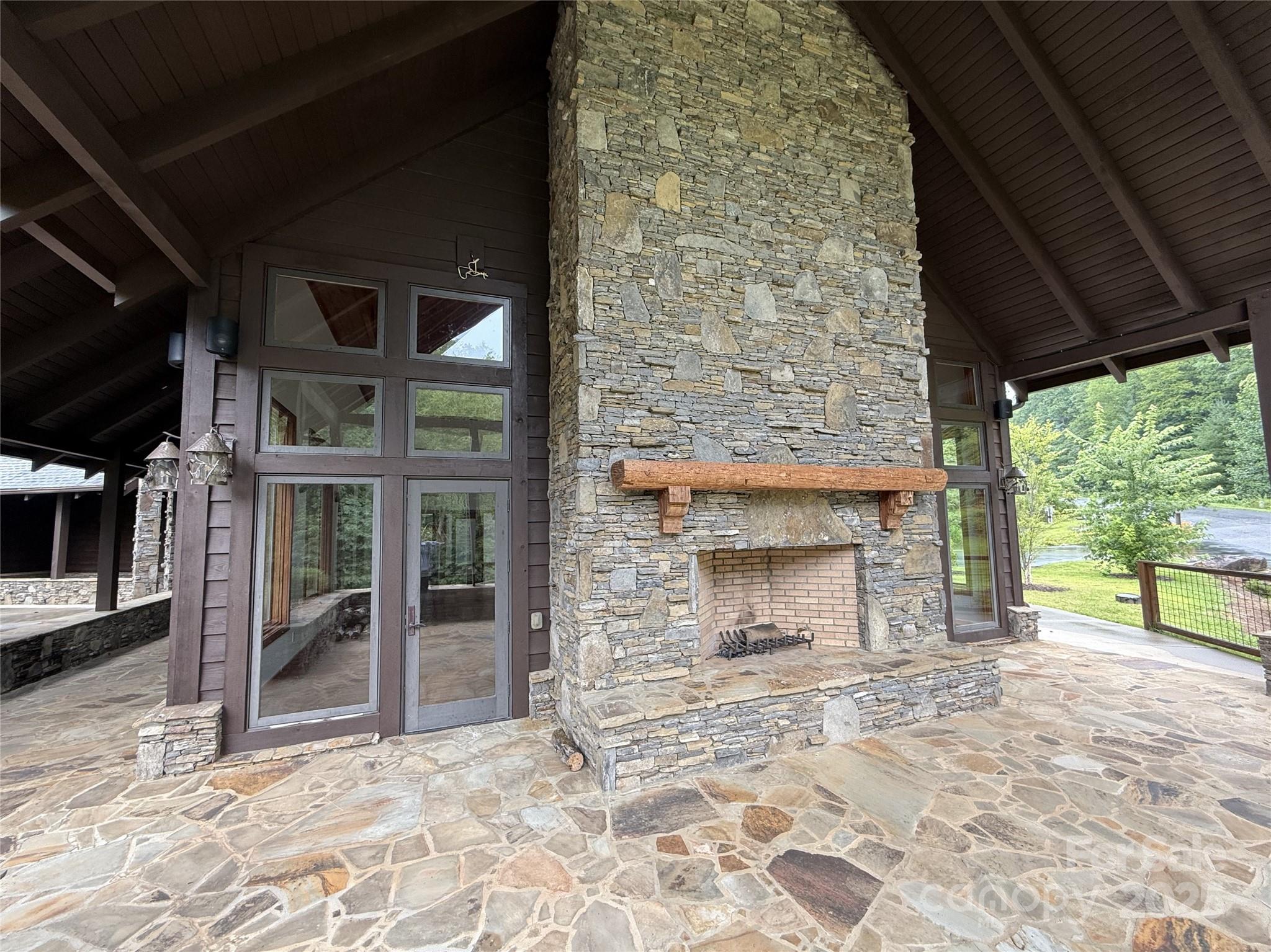 Lot 6 Garnet Road Sylva, NC 28779 - Photo 5 of 9 a view of empty room with a fireplace and a floor to ceiling window