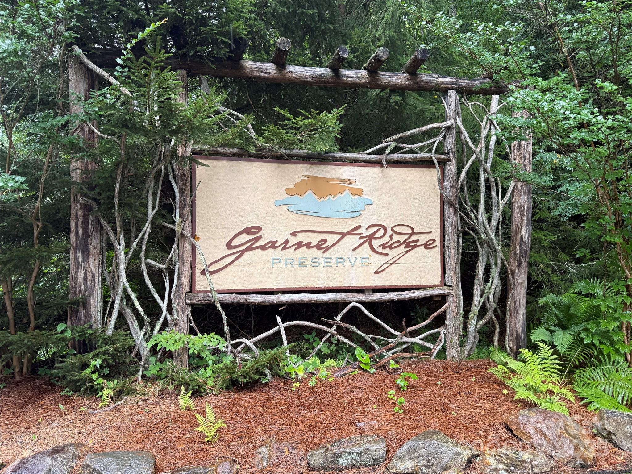 Lot 6 Garnet Road Sylva, NC 28779 - Photo 8 of 9 a sign that is on the side of the road