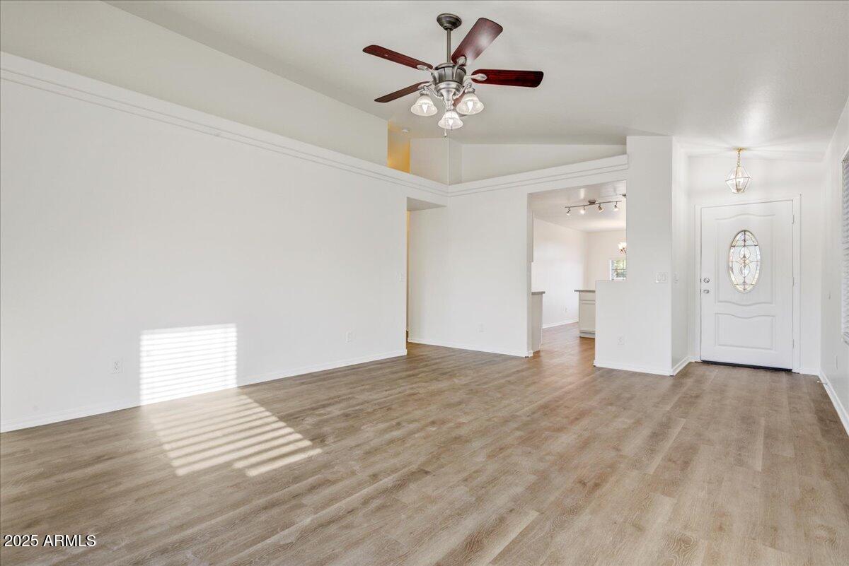 13009 West Port Royale Lane El Mirage, AZ 85335 - Photo 3 of 15 a view of an empty room with a ceiling fan