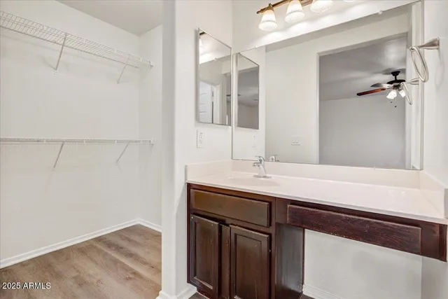 a bathroom with a sink and mirror