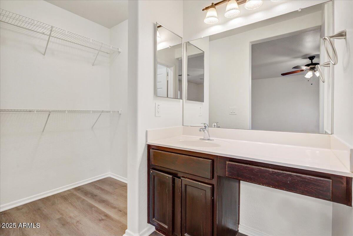 13009 West Port Royale Lane El Mirage, AZ 85335 - Photo 9 of 15 a bathroom with a sink and mirror