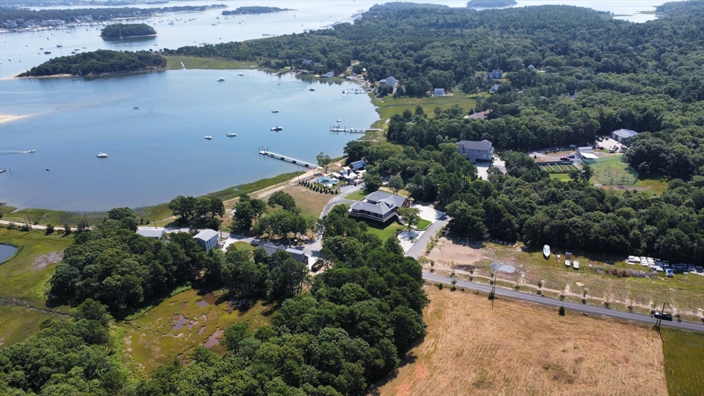 8 Over Jordan Road Wareham, MA 02571 - Photo 1 of 11 an aerial view of lake and residential houses with outdoor space