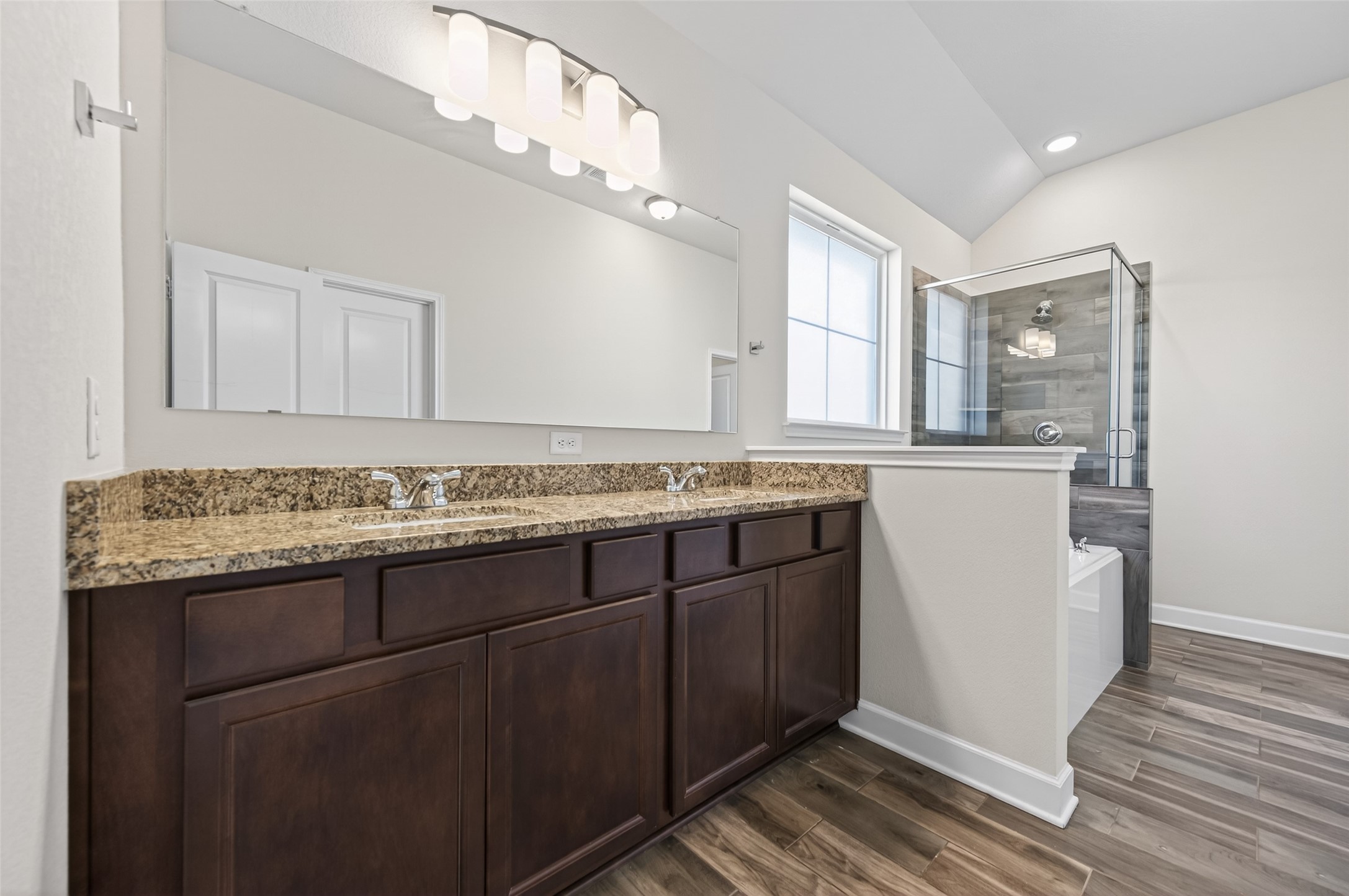 917 Farm Path Brenham, TX 77833 - Photo 22 of 43 a bathroom with a granite countertop sink and a mirror