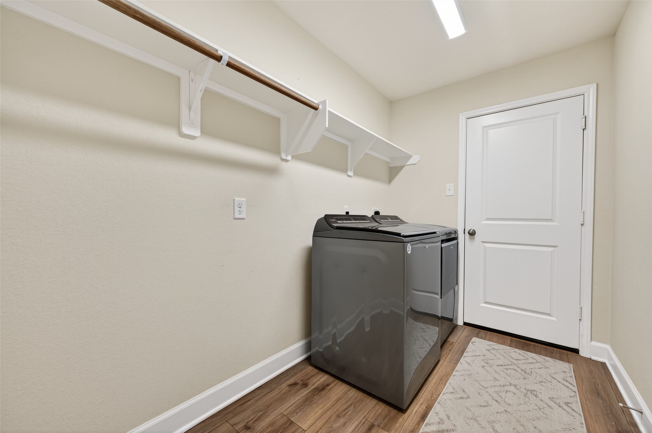 917 Farm Path Brenham, TX 77833 - Photo 28 of 43 a view of a storage & utility room with washer and dryer