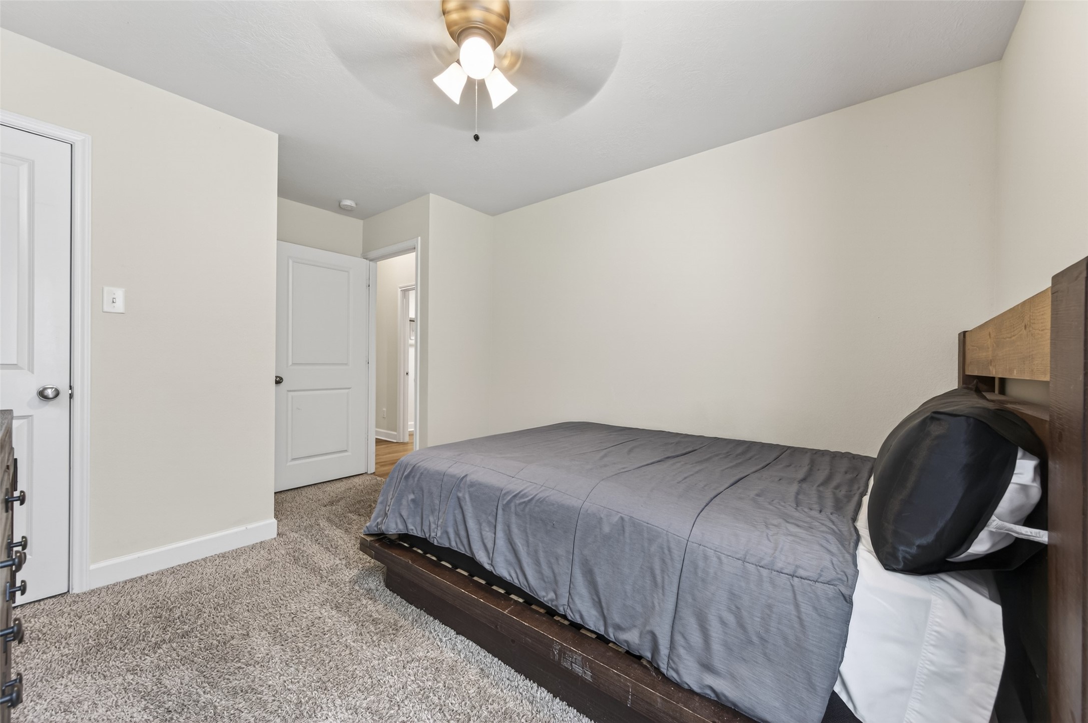 917 Farm Path Brenham, TX 77833 - Photo 31 of 43 a bedroom with a bed and a chair