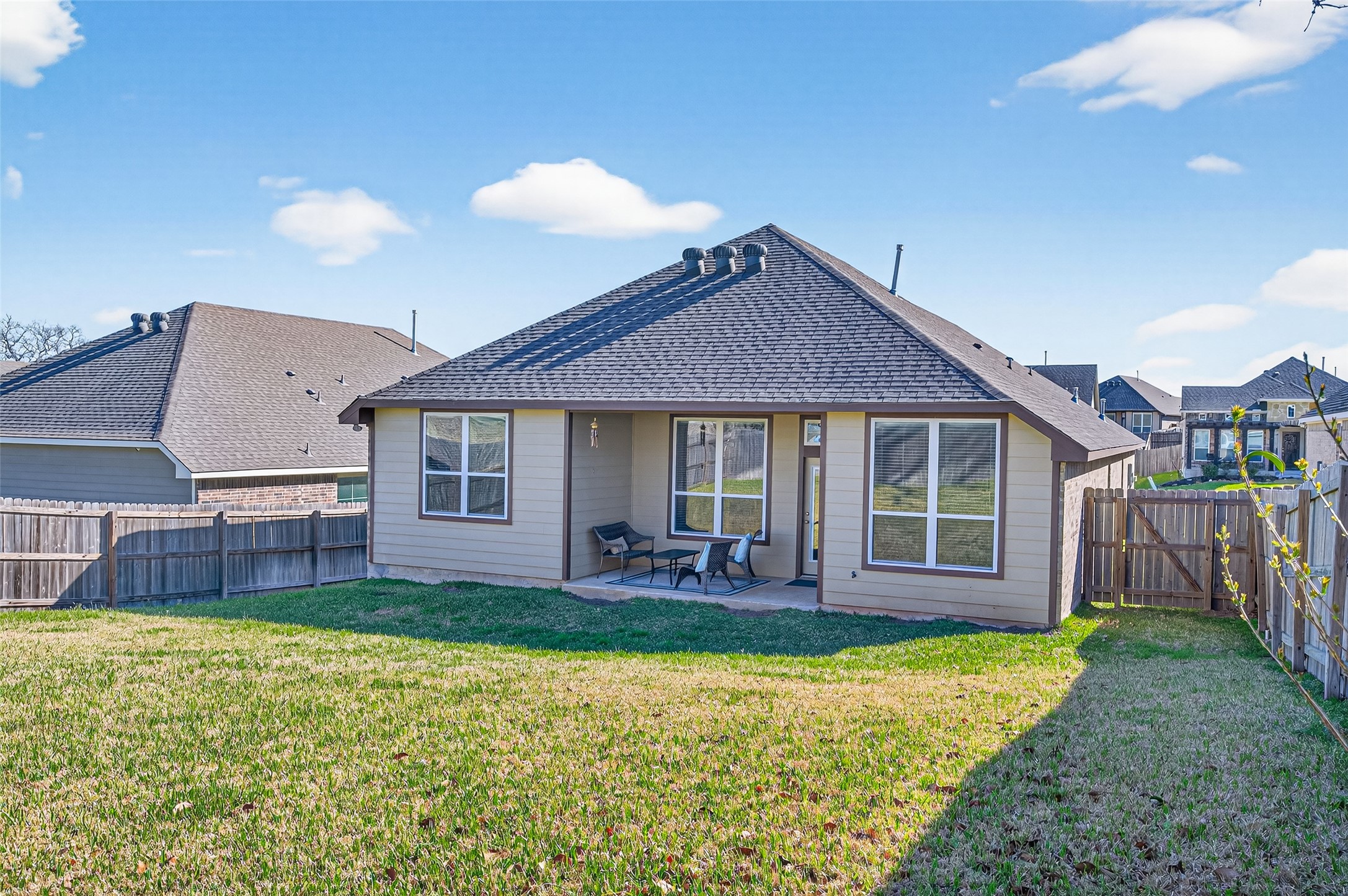 917 Farm Path Brenham, TX 77833 - Photo 42 of 43 a front view of a house with a garden and porch