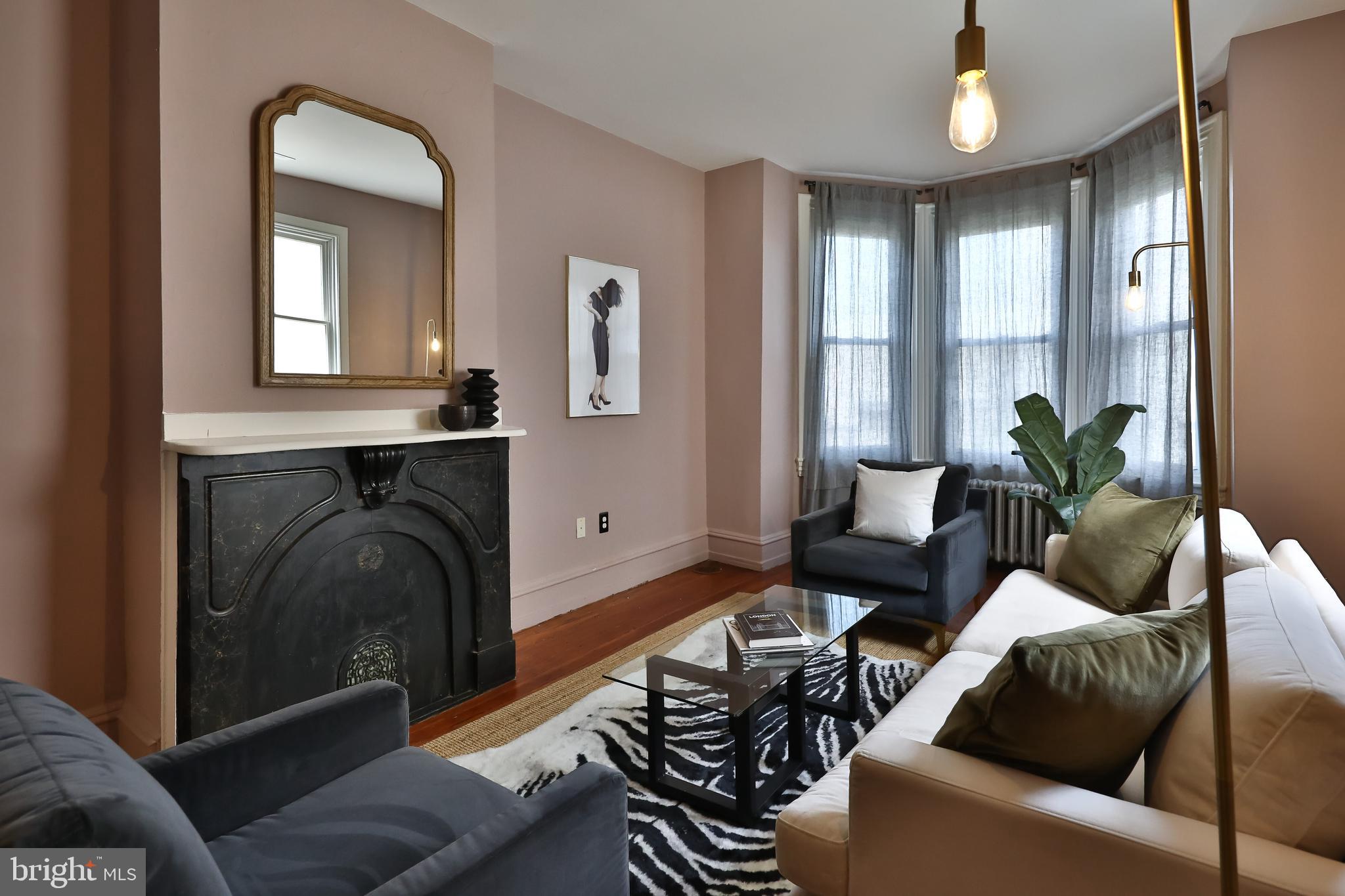 2805 Poplar Street Philadelphia, PA 19130 - Photo 20 of 34 a living room with furniture and a fireplace