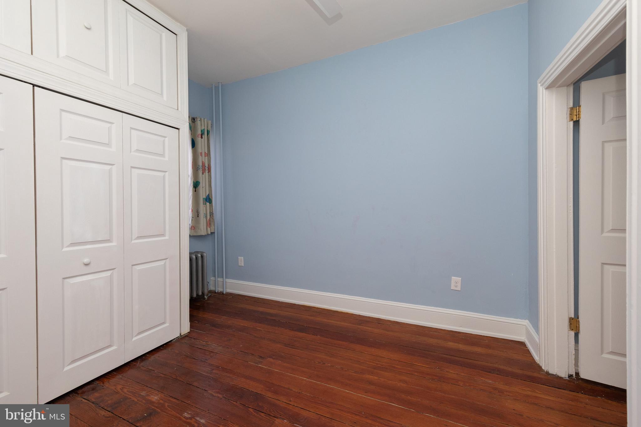2805 Poplar Street Philadelphia, PA 19130 - Photo 24 of 34 a view of an empty room with wooden floor