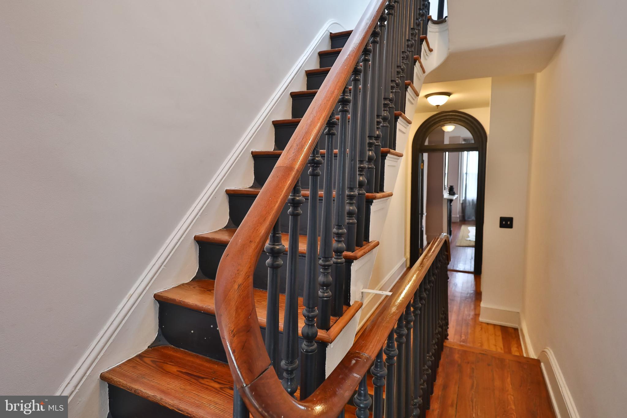 2805 Poplar Street Philadelphia, PA 19130 - Photo 29 of 34 a view of staircase with wooden floor and white walls