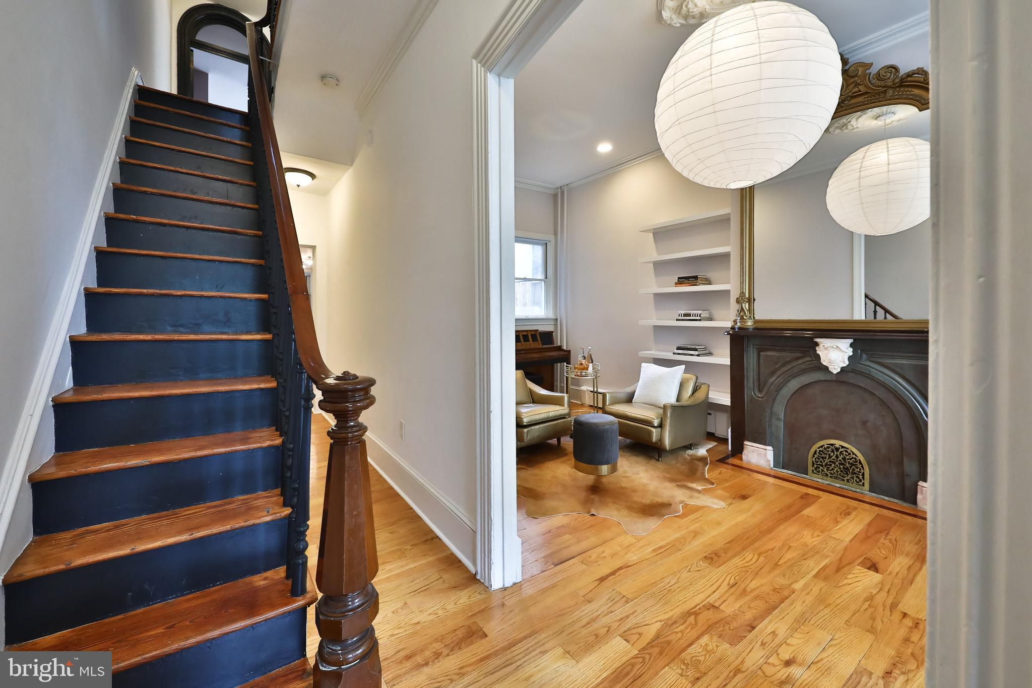 2805 Poplar Street Philadelphia, PA 19130 - Photo 3 of 34 wooden floor with windows and a fireplace