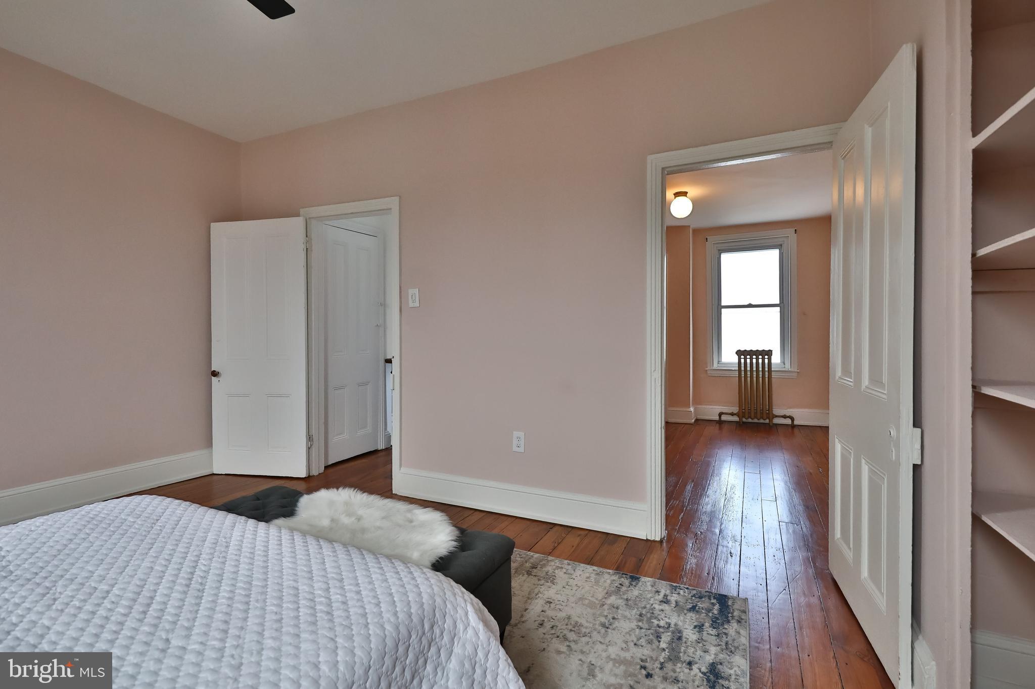 2805 Poplar Street Philadelphia, PA 19130 - Photo 31 of 34 a bedroom with a bed and wooden floor