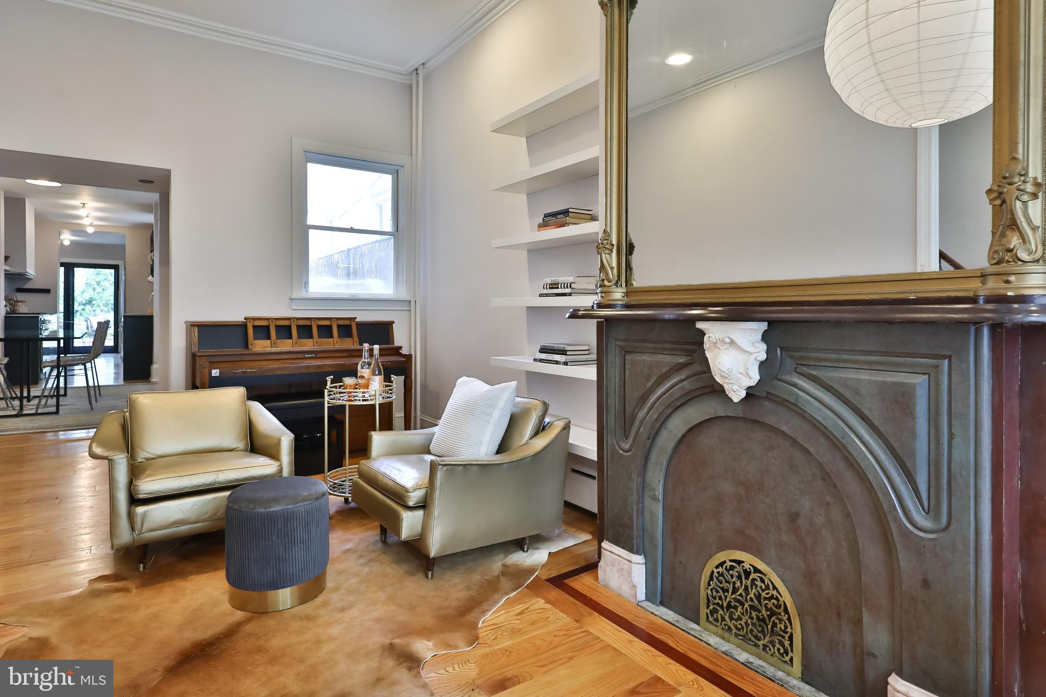 2805 Poplar Street Philadelphia, PA 19130 - Photo 6 of 34 a living room with furniture and a fireplace