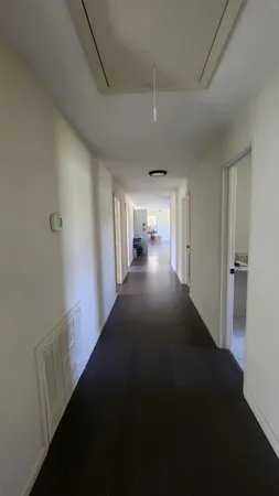 a view of an empty room and window