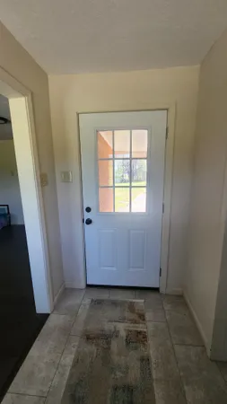 a room with furniture and a window