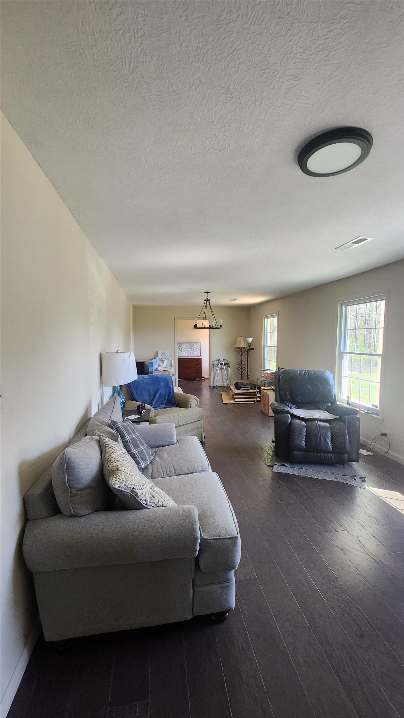 3226 19th Highway West Ripley, TN 38063 - Photo 7 of 18 Living area with dark wood-type flooring and a textured ceiling