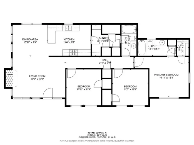 a front view of a house with a garden and plants