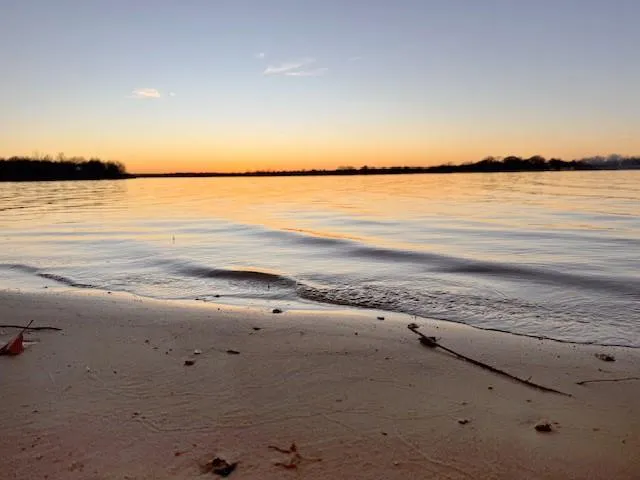 a kitchen with granite countertop a stove and a sink