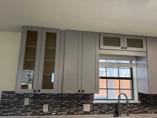 a kitchen with a sink stove and refrigerator