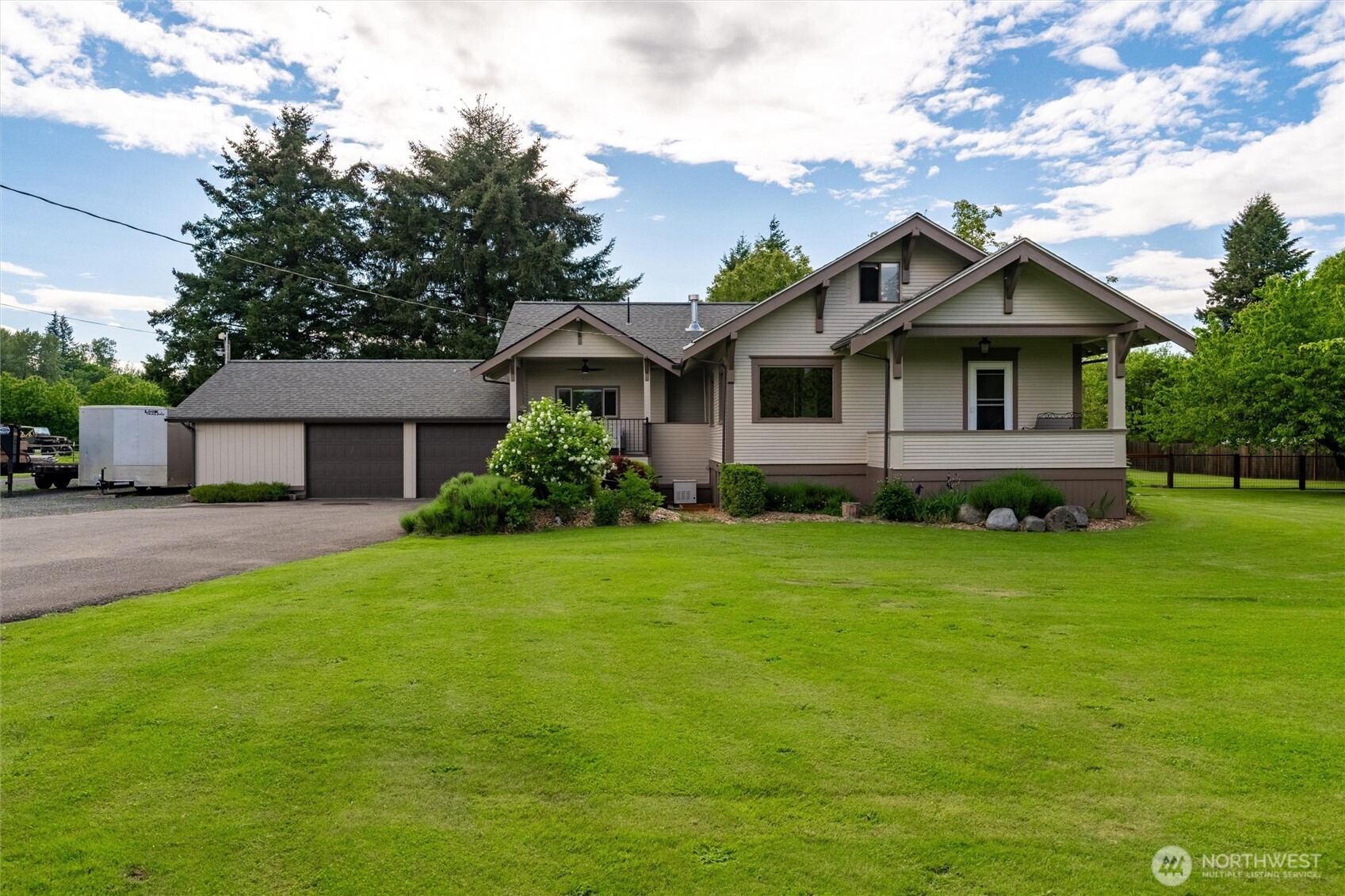5875 Sand Road Bellingham, WA 98226 - Photo 1 of 40 a front view of a house with a garden
