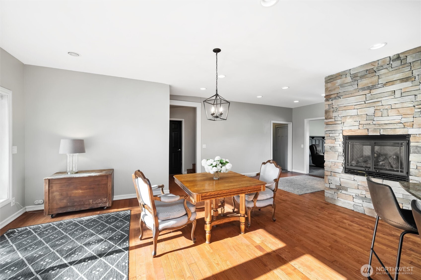 5875 Sand Road Bellingham, WA 98226 - Photo 11 of 40 a dining room with a wooden table and chairs