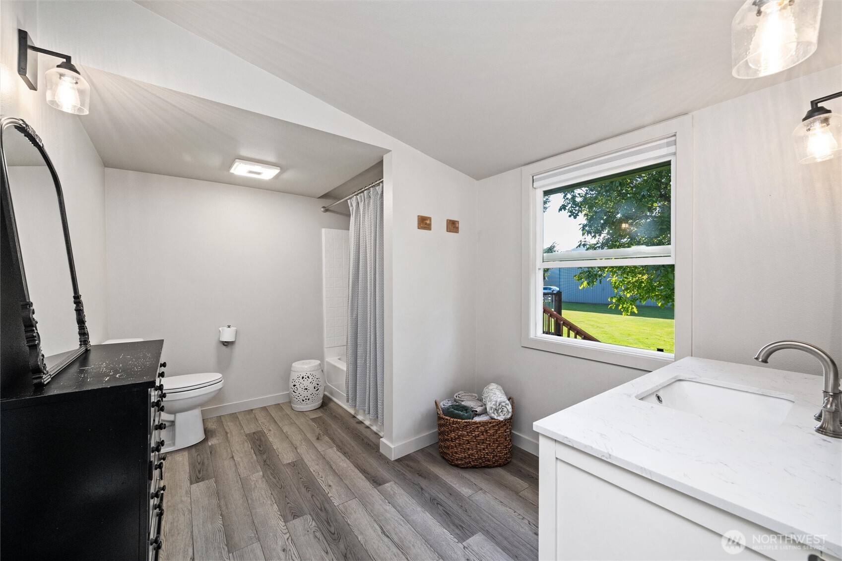 5875 Sand Road Bellingham, WA 98226 - Photo 18 of 40 a bathroom with a sink a toilet and a window
