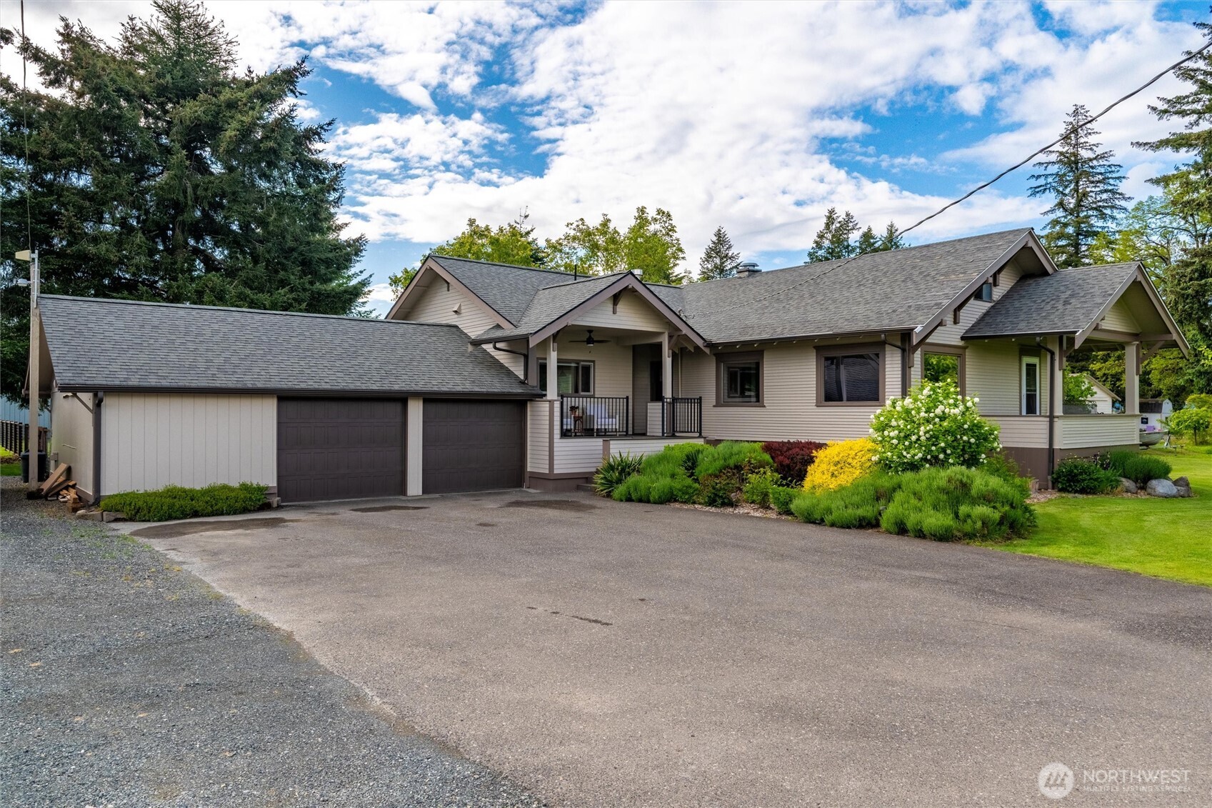 5875 Sand Road Bellingham, WA 98226 - Photo 2 of 40 a front view of a house with a garden and yard