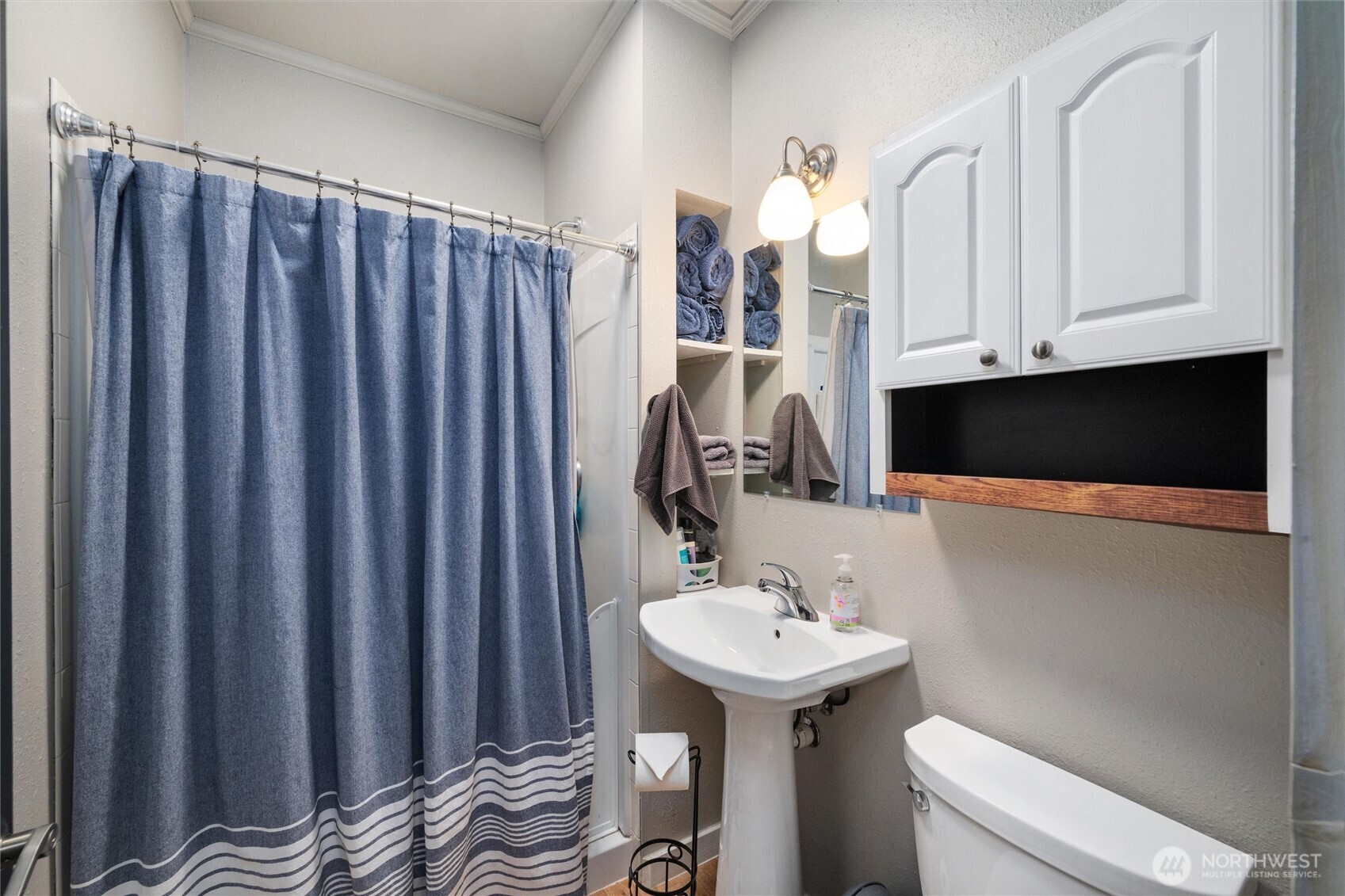 5875 Sand Road Bellingham, WA 98226 - Photo 23 of 40 a bathroom with a sink a toilet and mirror