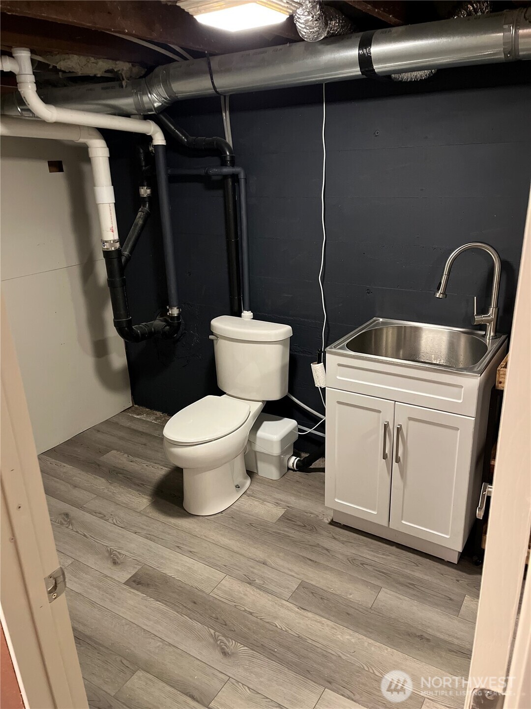 5875 Sand Road Bellingham, WA 98226 - Photo 29 of 40 a bathroom with a toilet and a sink