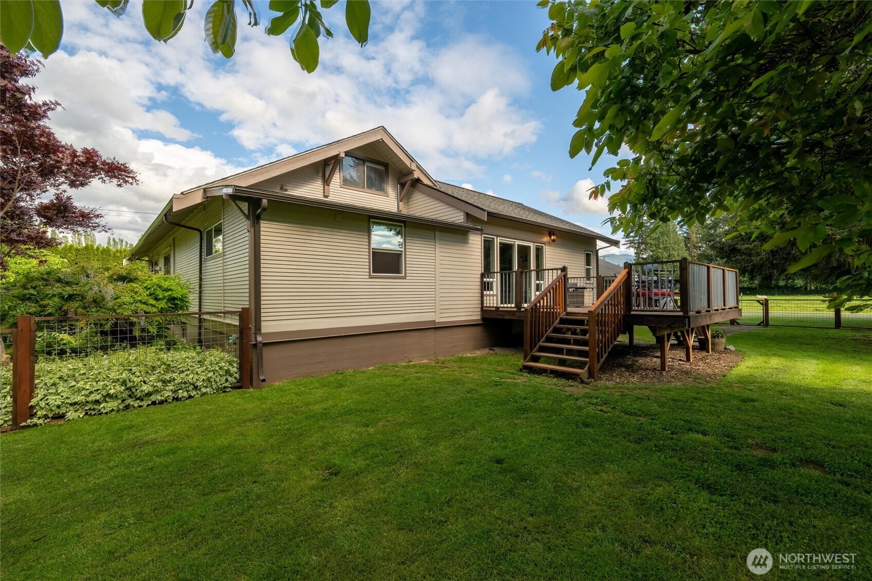 5875 Sand Road Bellingham, WA 98226 - Photo 31 of 40 a backyard of a house with table and chairs