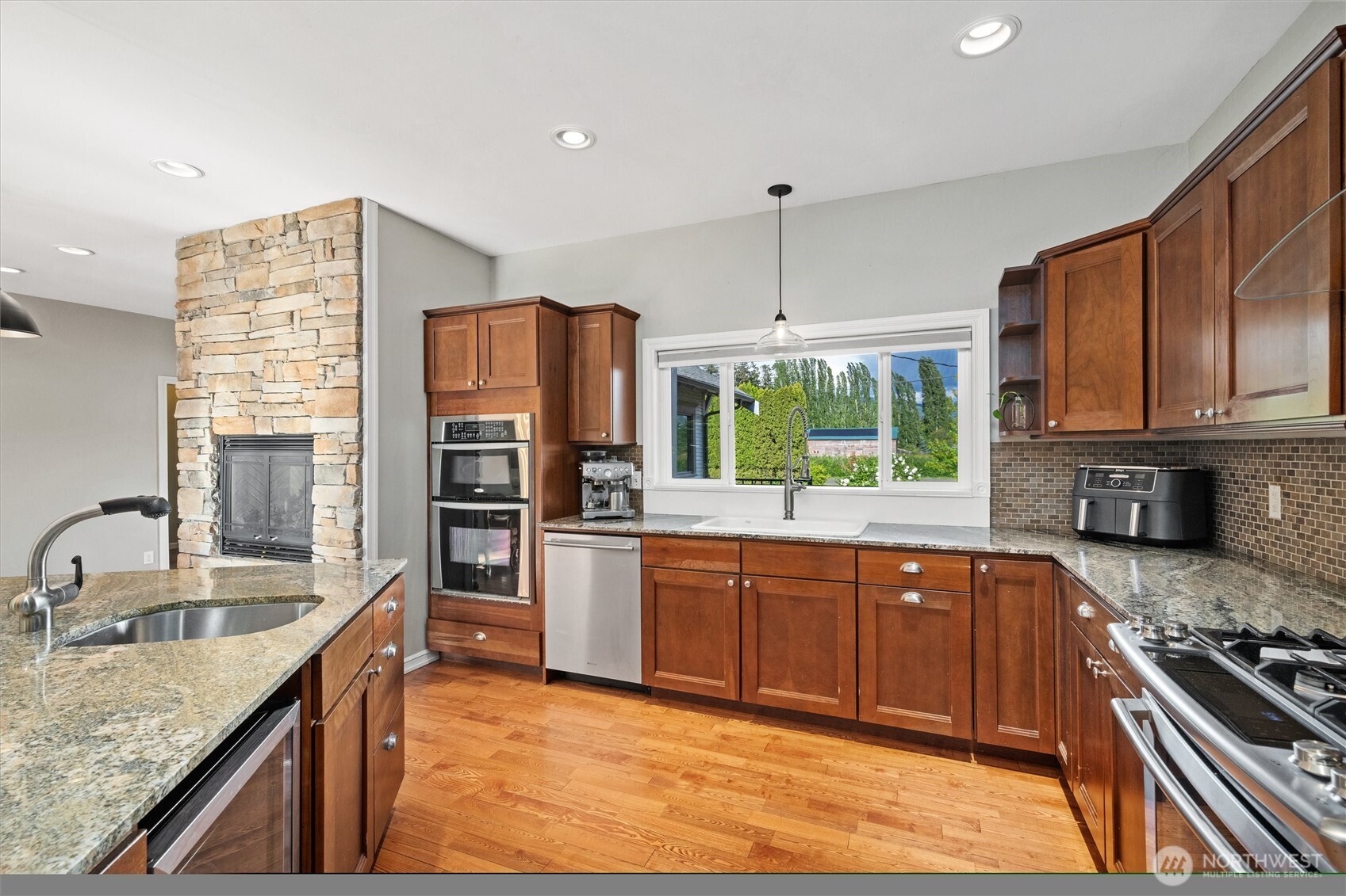 5875 Sand Road Bellingham, WA 98226 - Photo 9 of 40 a kitchen with stainless steel appliances granite countertop a sink stove and refrigerator