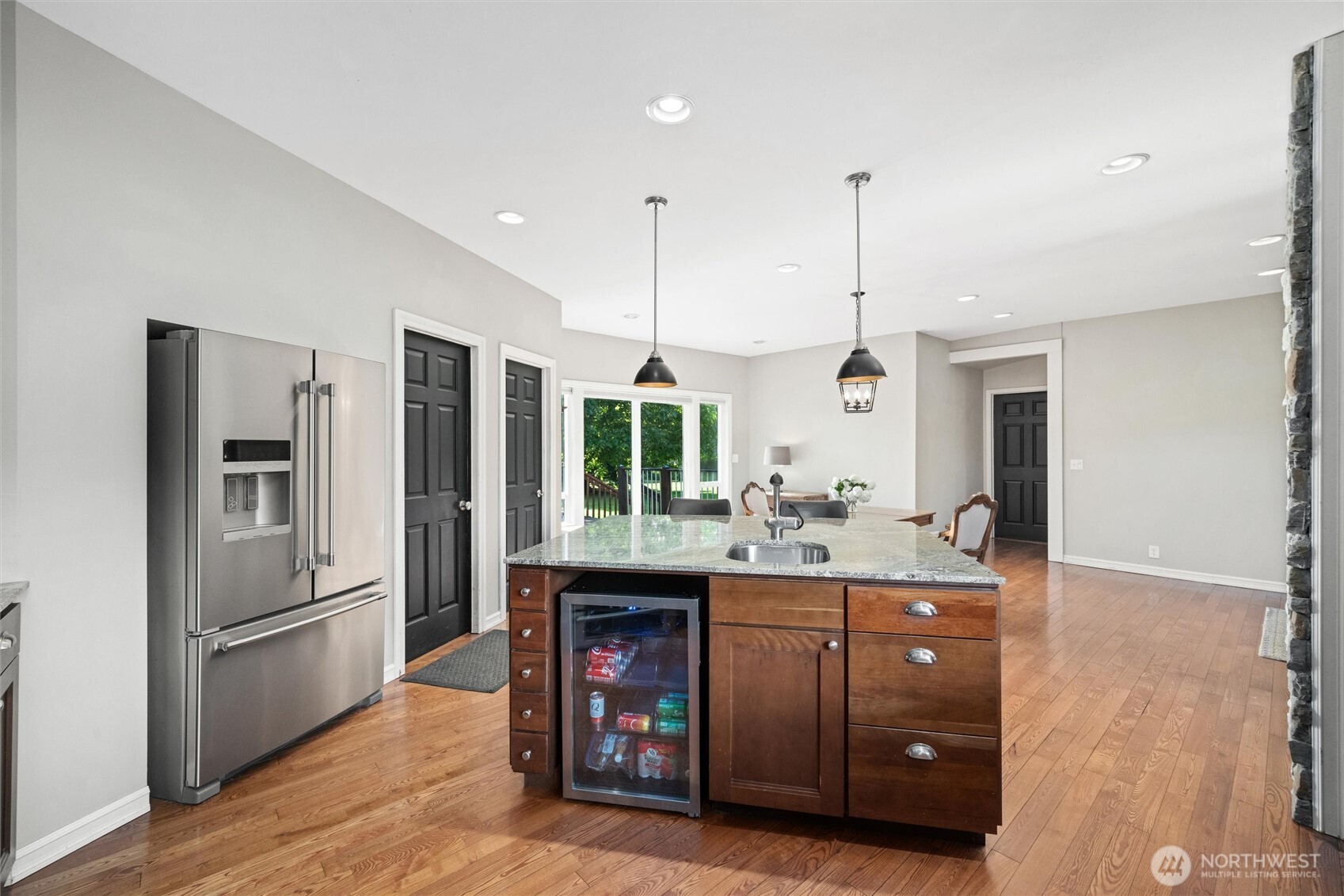 5875 Sand Road Bellingham, WA 98226 - Photo 10 of 40 a kitchen with kitchen island a counter top space a sink appliances and cabinets