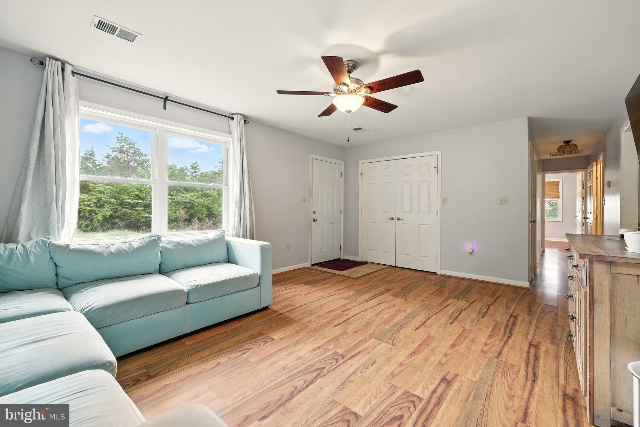 859 Colley Block Road Strasburg, VA 22657 - Photo 19 of 52 a living room with furniture and a large window