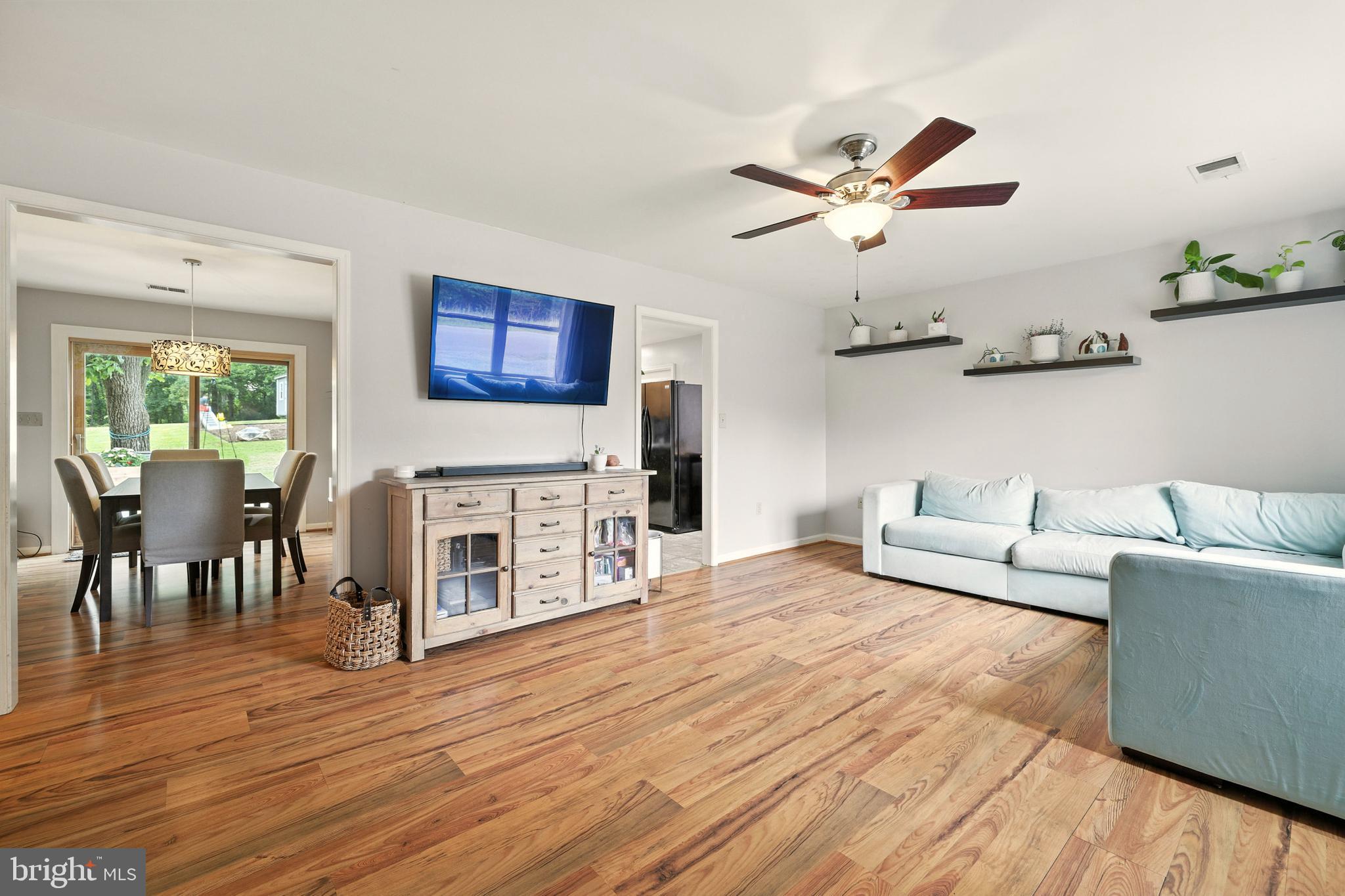 859 Colley Block Road Strasburg, VA 22657 - Photo 5 of 52 a living room with furniture wooden floor and a fireplace