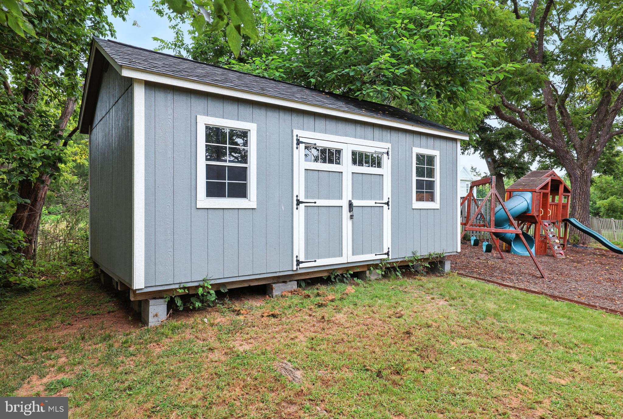 859 Colley Block Road Strasburg, VA 22657 - Photo 51 of 52 a backyard of a house with barbeque oven table and chairs