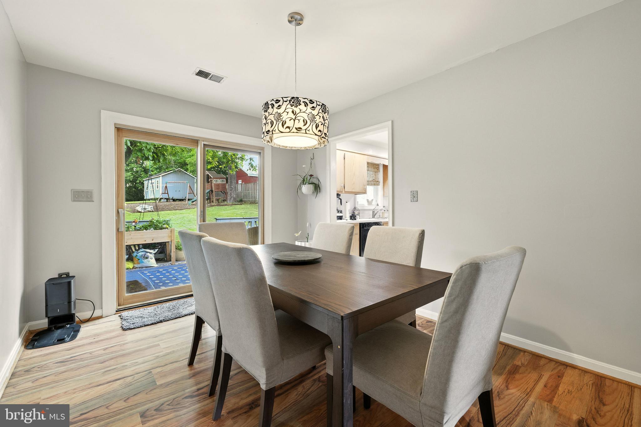 859 Colley Block Road Strasburg, VA 22657 - Photo 6 of 52 a view of a dining room with furniture window and wooden floor
